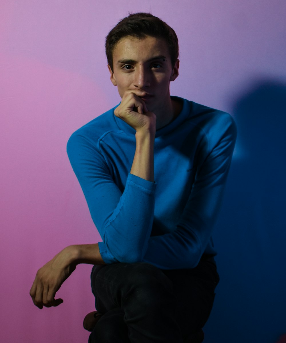 man wearing blue long-sleeved shirt