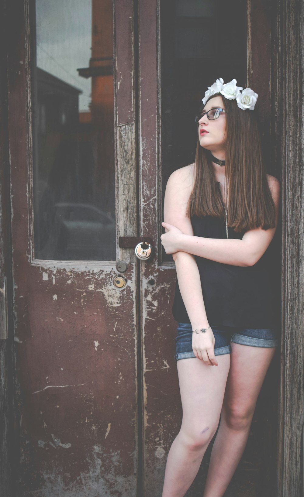 woman leaning on wall