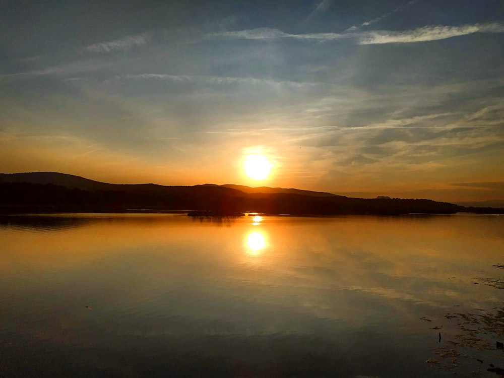 body of water during golden hour