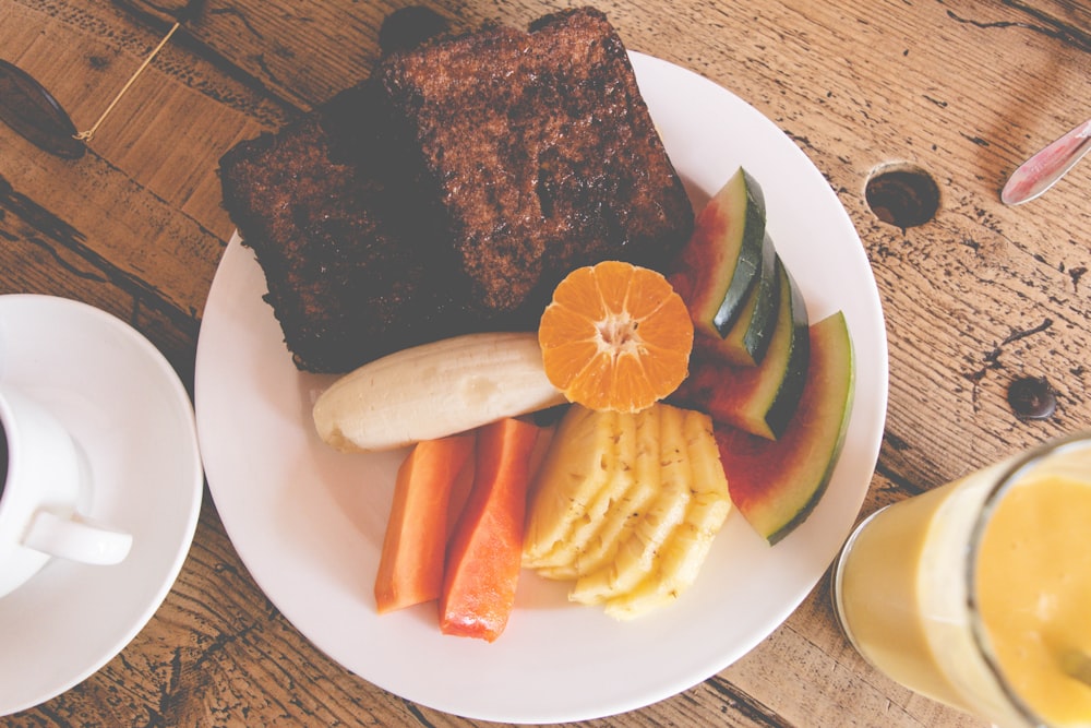 sliced fruits on plate