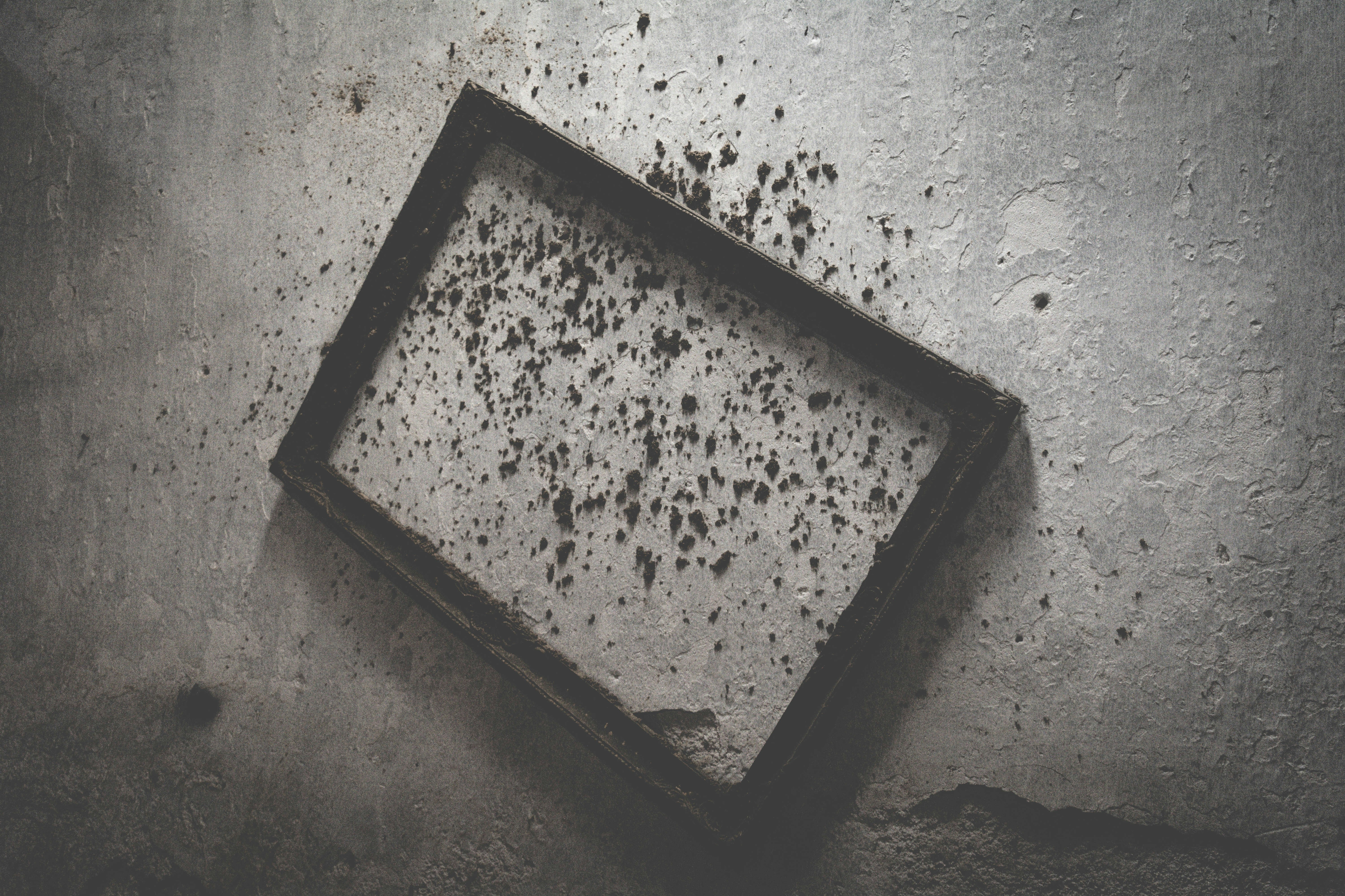 brown wooden frame on gray concrete surface
