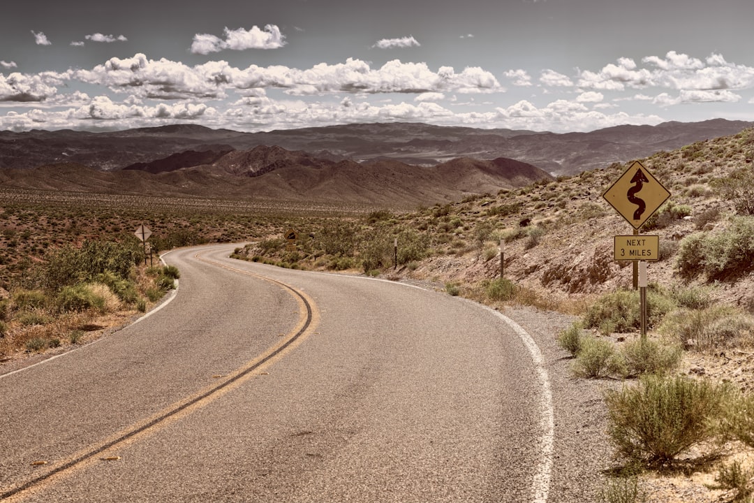 road on desert during daytime