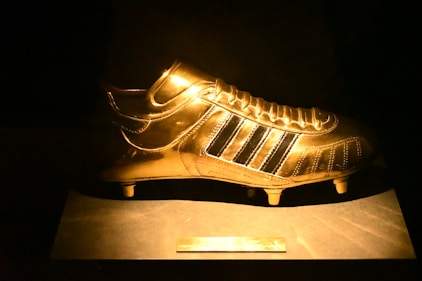 golden Adidas cleat