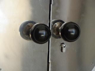 Close-up of high-quality door locks and knobs installed on a new front door.