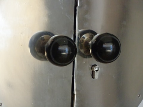 Close-up of high-quality door locks and knobs installed on a new front door.