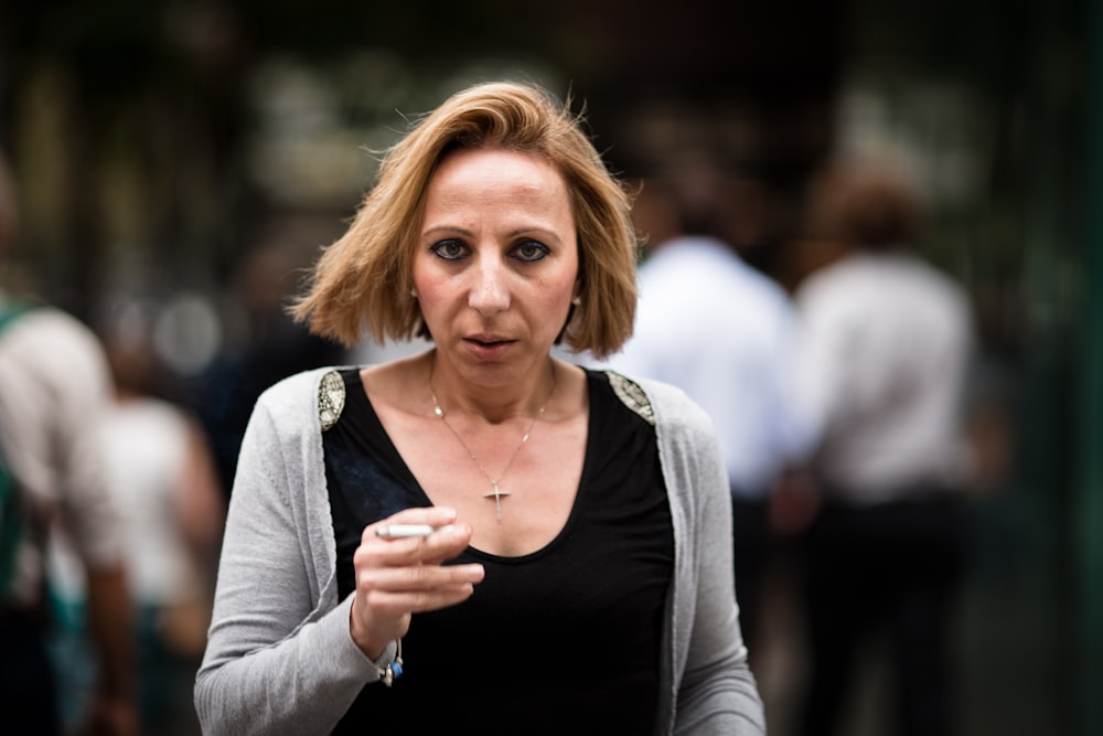 woman smoking during daytime