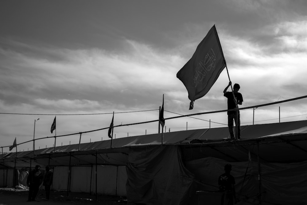 rule of thirds photography of unknown person carrying flag