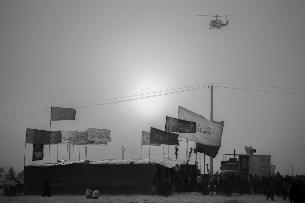 grayscale photo of flags