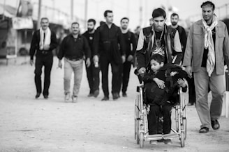 a group of men walking down a street