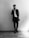 man leaning beside wall