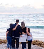 a family of four on a beach