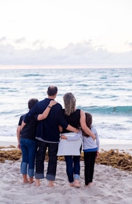 a family of four on a beach