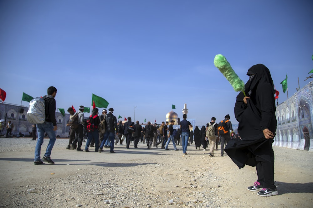 person wearing black abaya