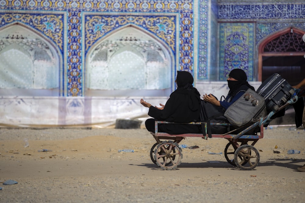 two women in a cart