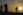 crowd walking at sunset