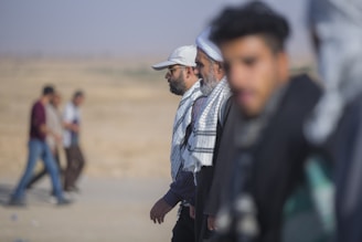 A group of Bedouin community members participating in a vocational training session outdoors.