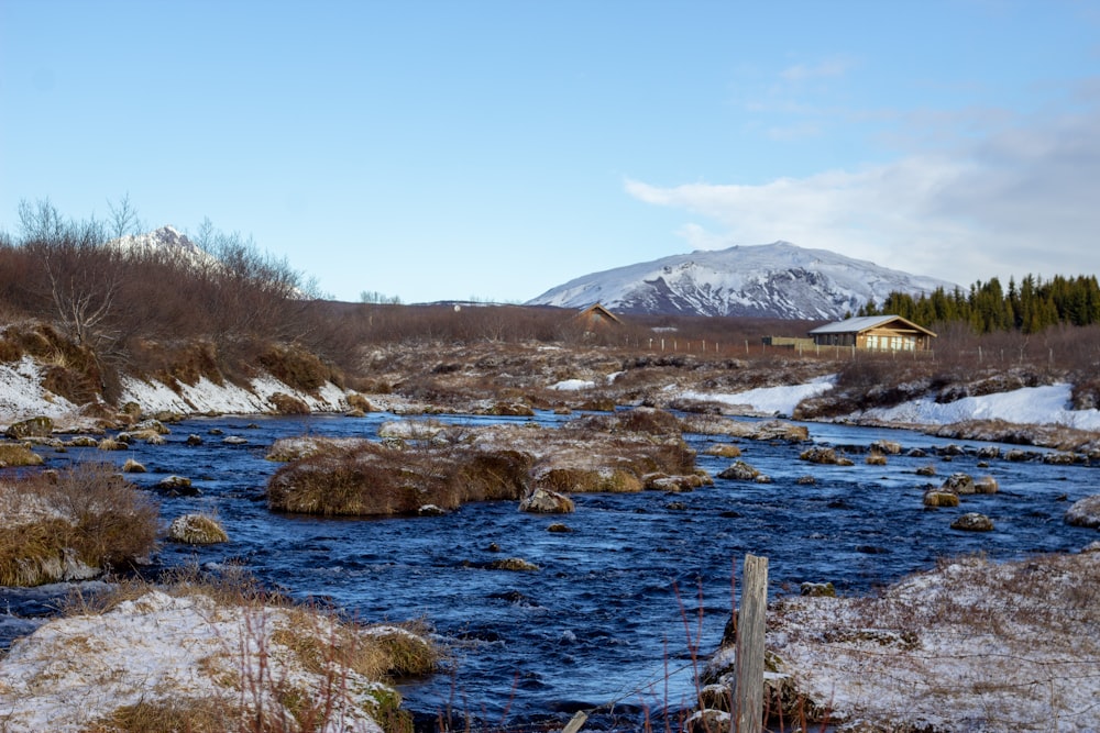 a river running through a snow covered field