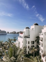 a cruise ship is in the background of a white building
