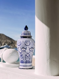 white and blue ceramic floral floor vase