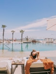 woman lying on lounge chair