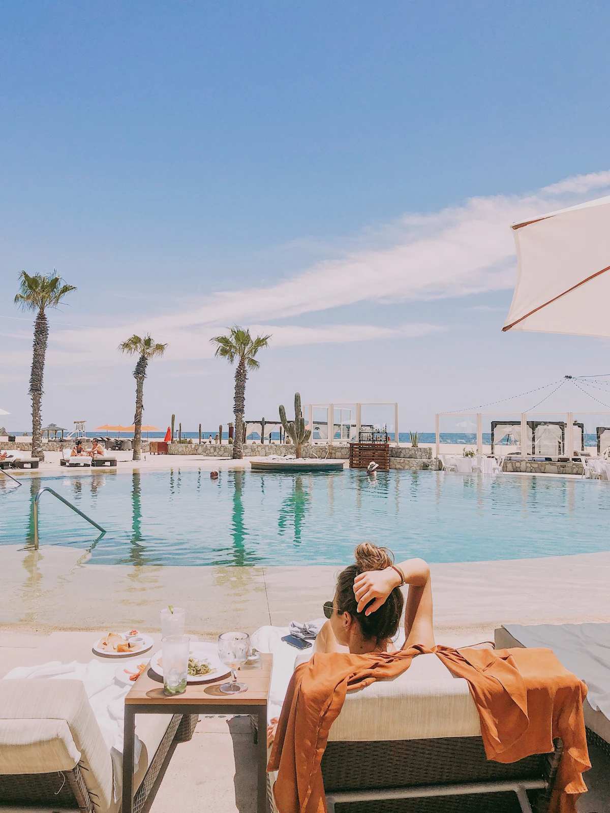 Guest relaxing on a lounge chair at a resort