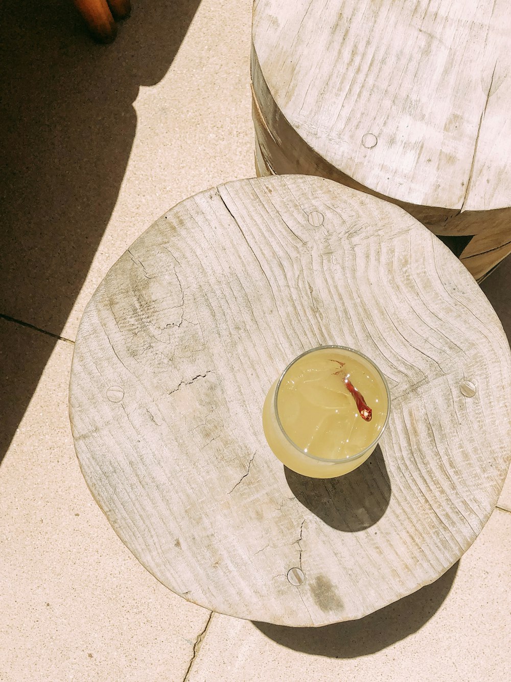 clear drinking glass on brown wooden table