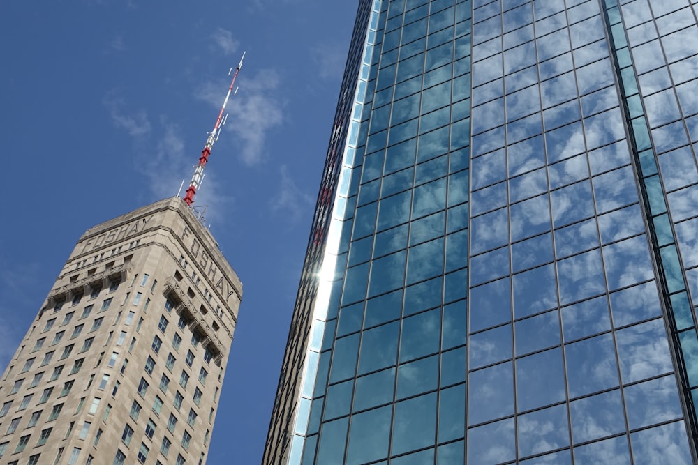 a very tall building next to a very tall building