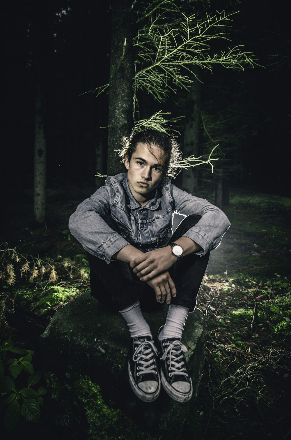 man sitting on stone