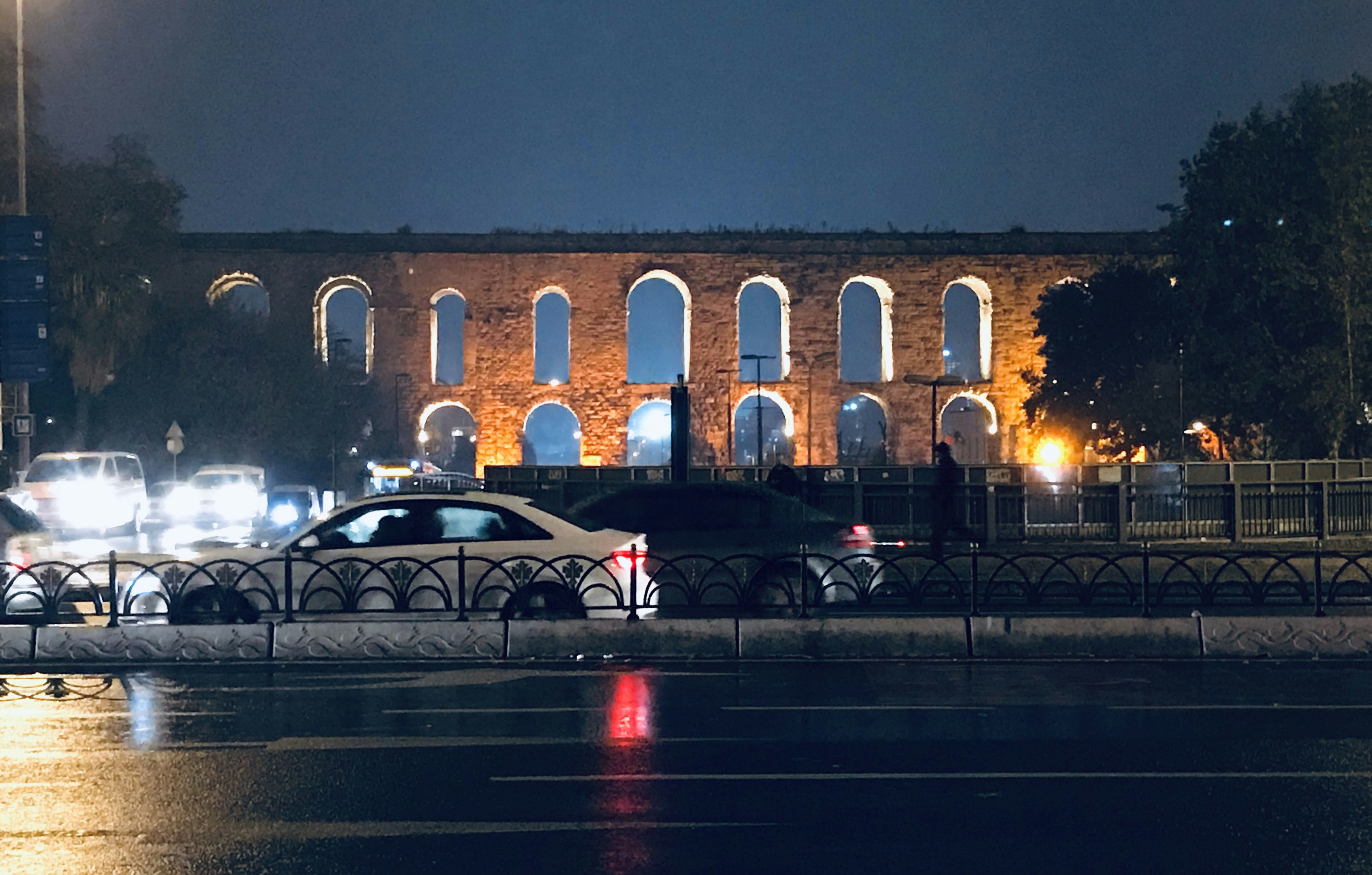 white sedan traveling on road