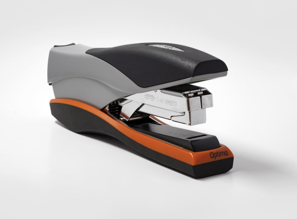 black and orange Optima stapler