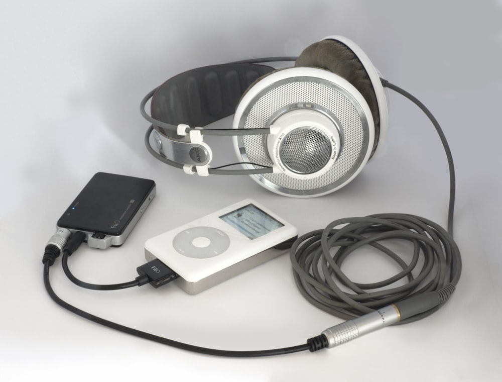 white and silver headphones