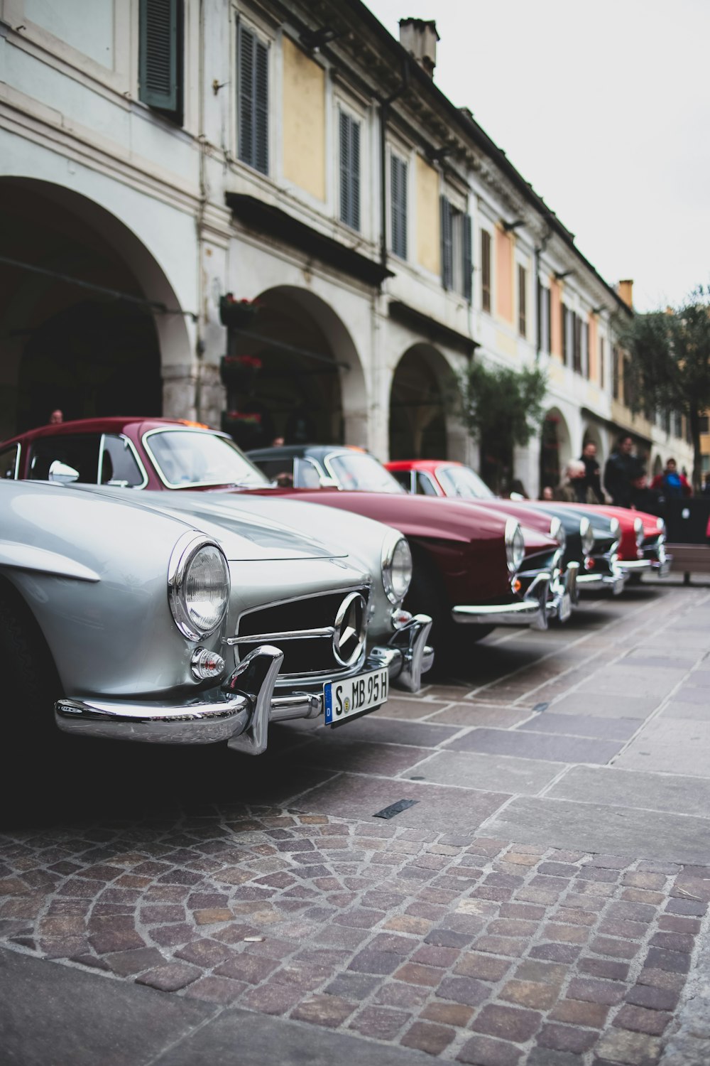 a row of parked vintage cars