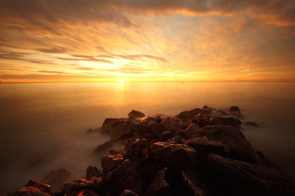 body of water during golden hour