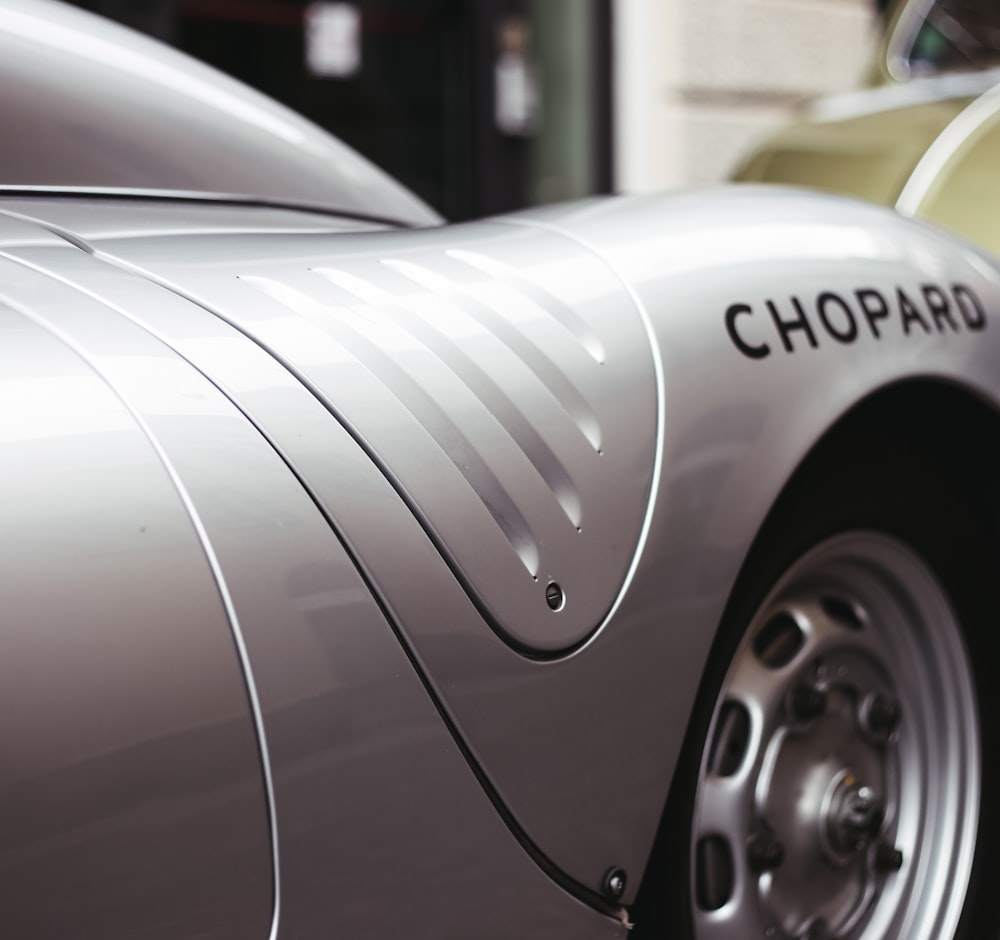 a close up of the front of a classic car