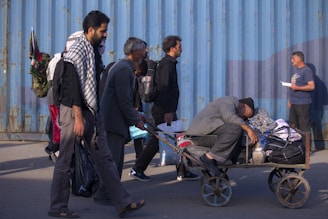 man wearing gray long-sleeved shirt riding cart