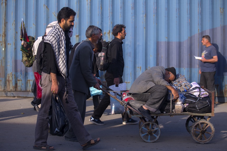 man wearing gray long-sleeved shirt riding cart