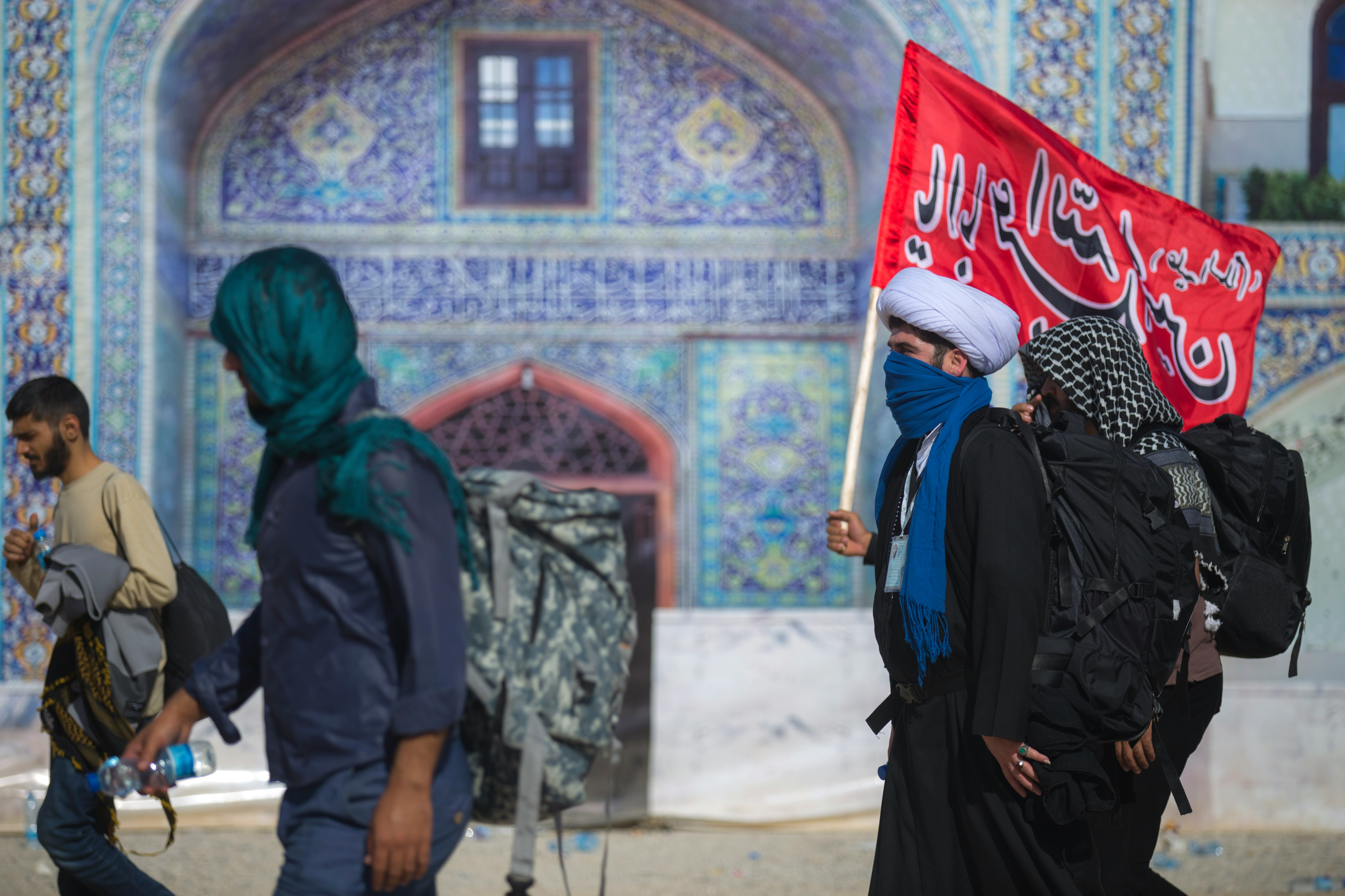 An akhoond  is a Persian title for an Islamic cleric, common in Iran, Azerbaijan and some parts of Afghanistan and Pakistan. The Standard Chinese word for imam used in particular by the Hui people, also derives from this term.
(Arbaeen Pilgrimage- Mehran City, Iran)