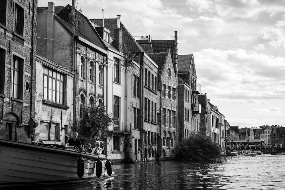 grayscale photo of boat on body of water