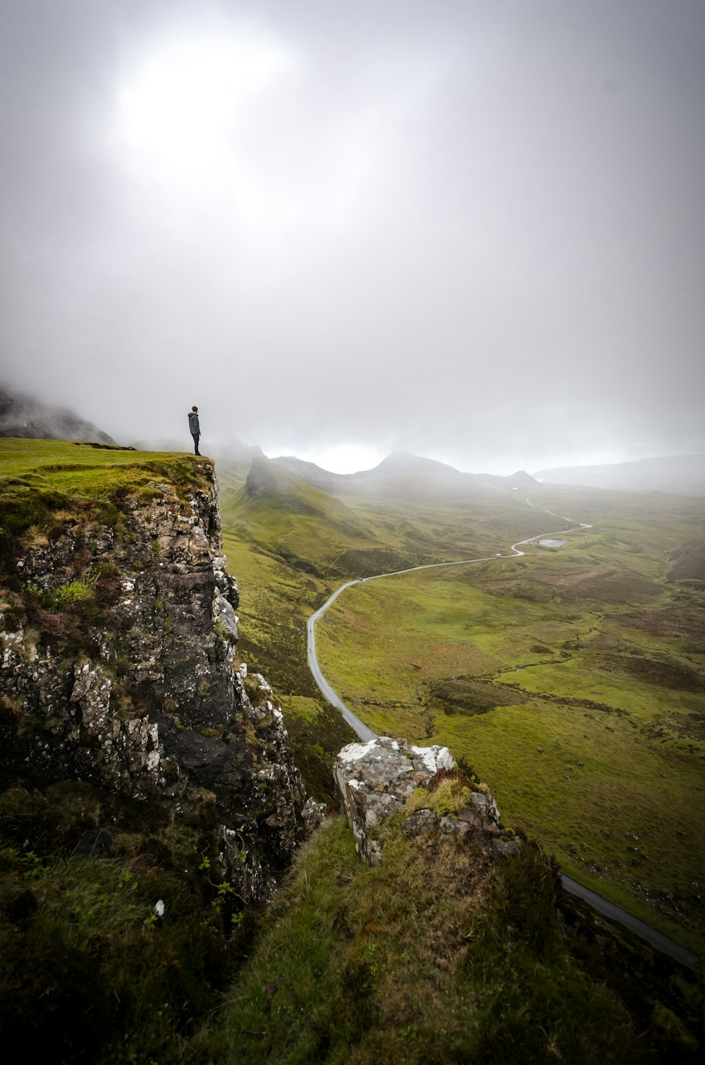 person on top of mountain