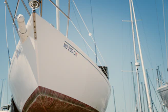 white sailboat at the dock during daytime