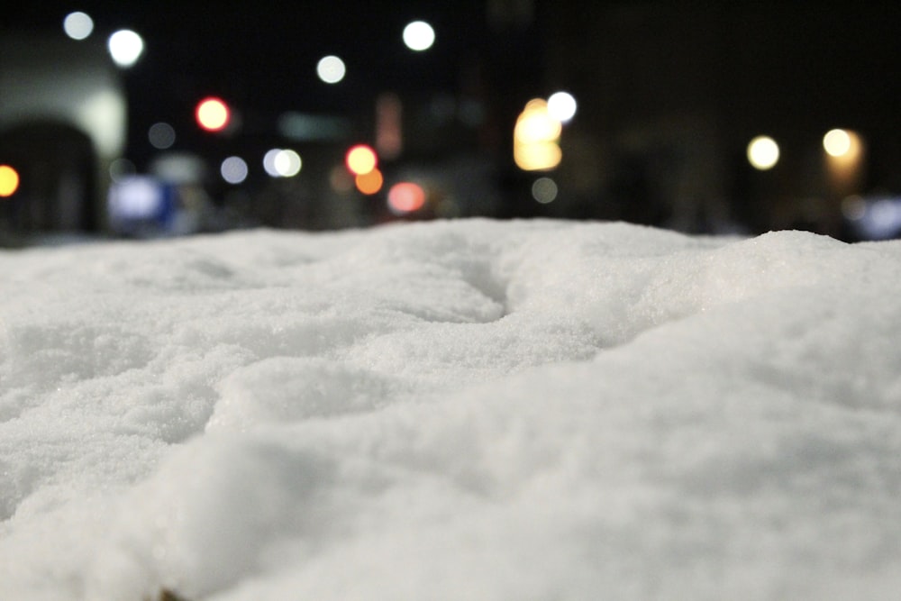 a close up of snow on a city street