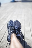 Close-up of a vibrant, comfortable espadrille on a sunlit wooden bench.