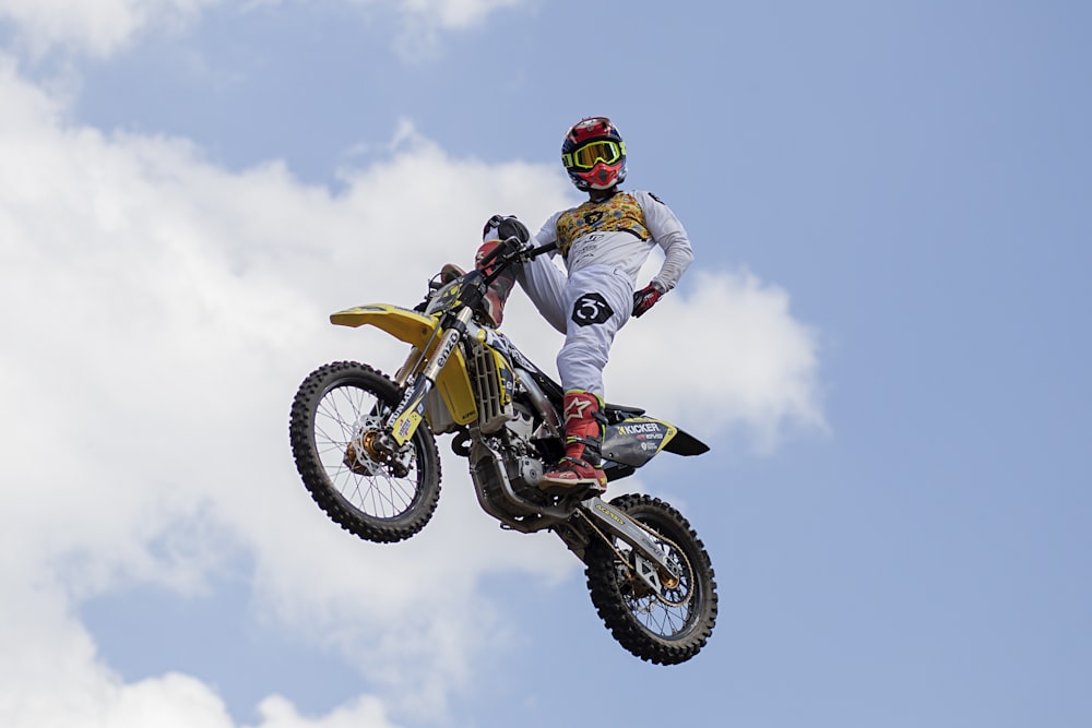 man riding on motocross dirt bike