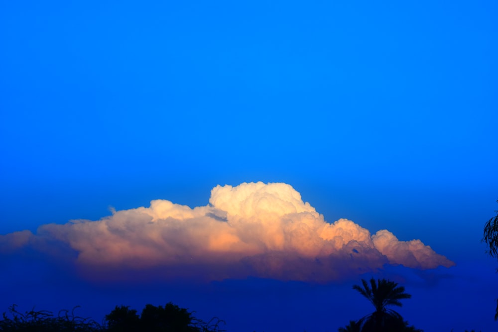 gold clouds under blue sky