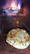 Warm, cinematic shot of a pizza fresh out of the oven with glowing embers in the background.