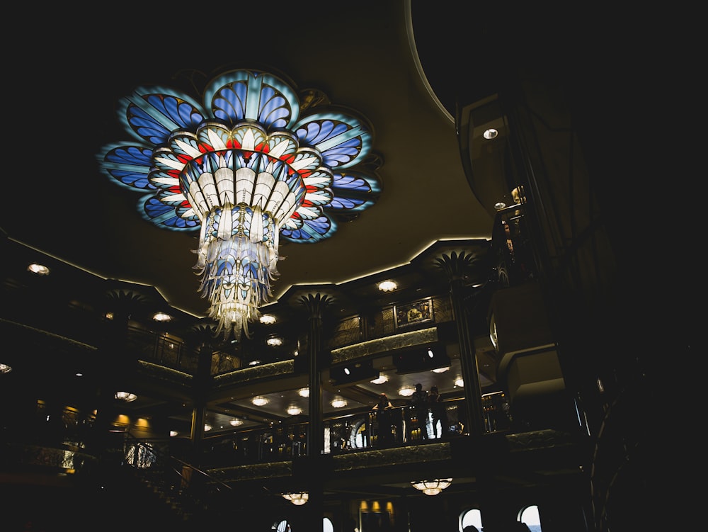 building with indoor balconies and chandelier turned on