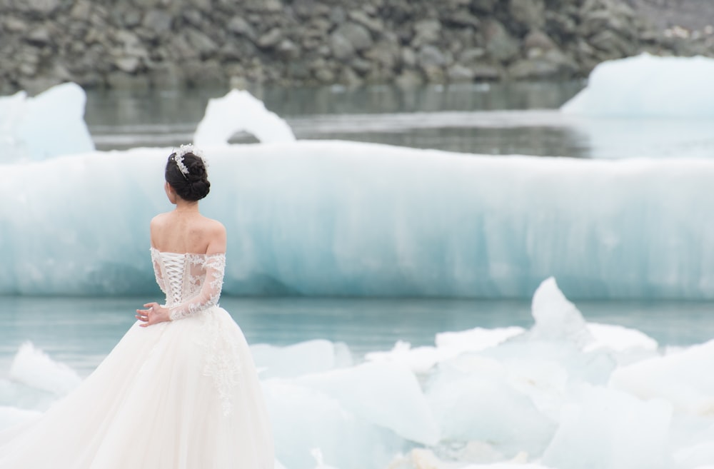 woman standing near body of water