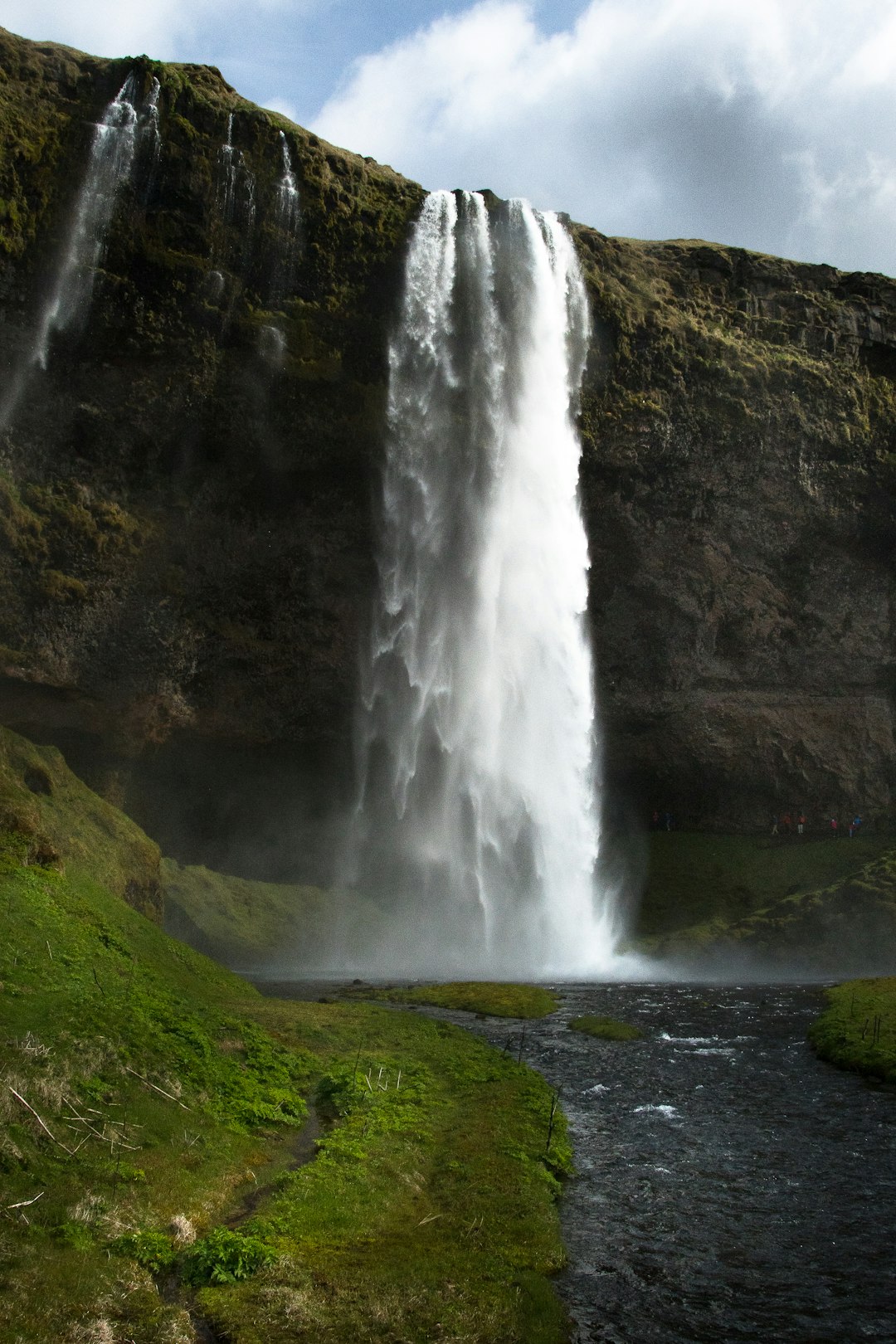 waterfalls photo across white clouds during daytime