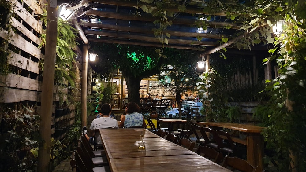 rectangular brown wooden table at night