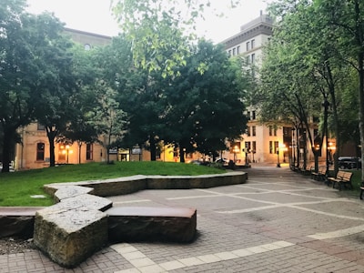 Completed public park with benches and landscaping in urban area.